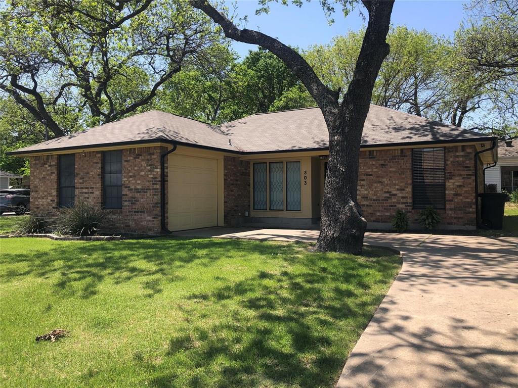 a house with a tree in front of a house