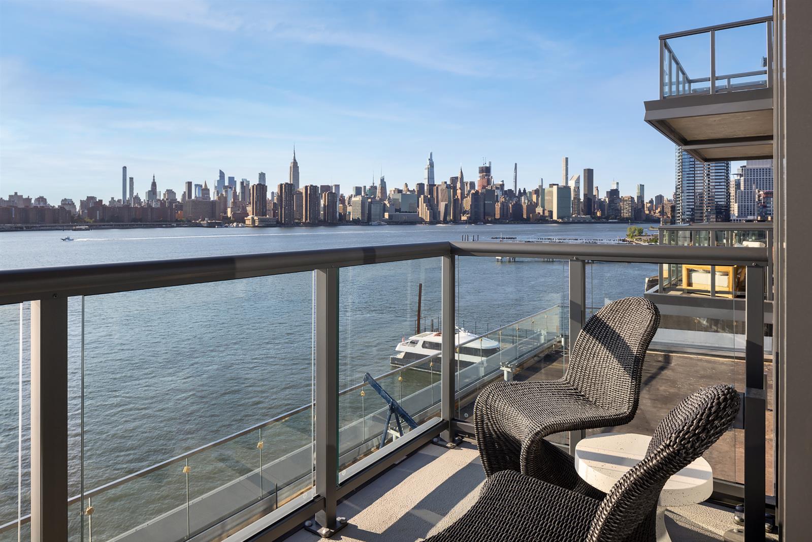 a view of a balcony with an outdoor seating