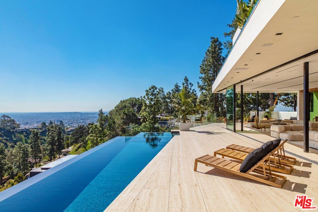 a view of swimming pool with lounge chair