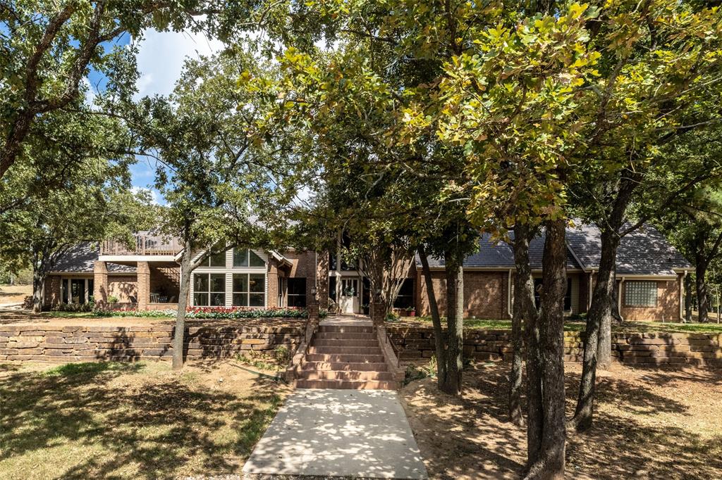 a backyard of a house with large trees