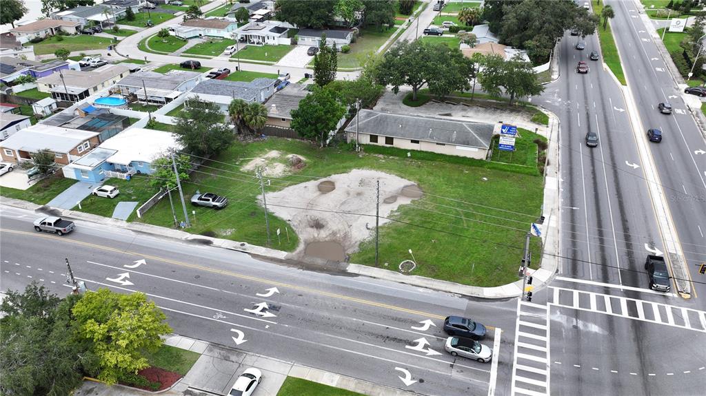 an aerial view of a house with a garden and plants