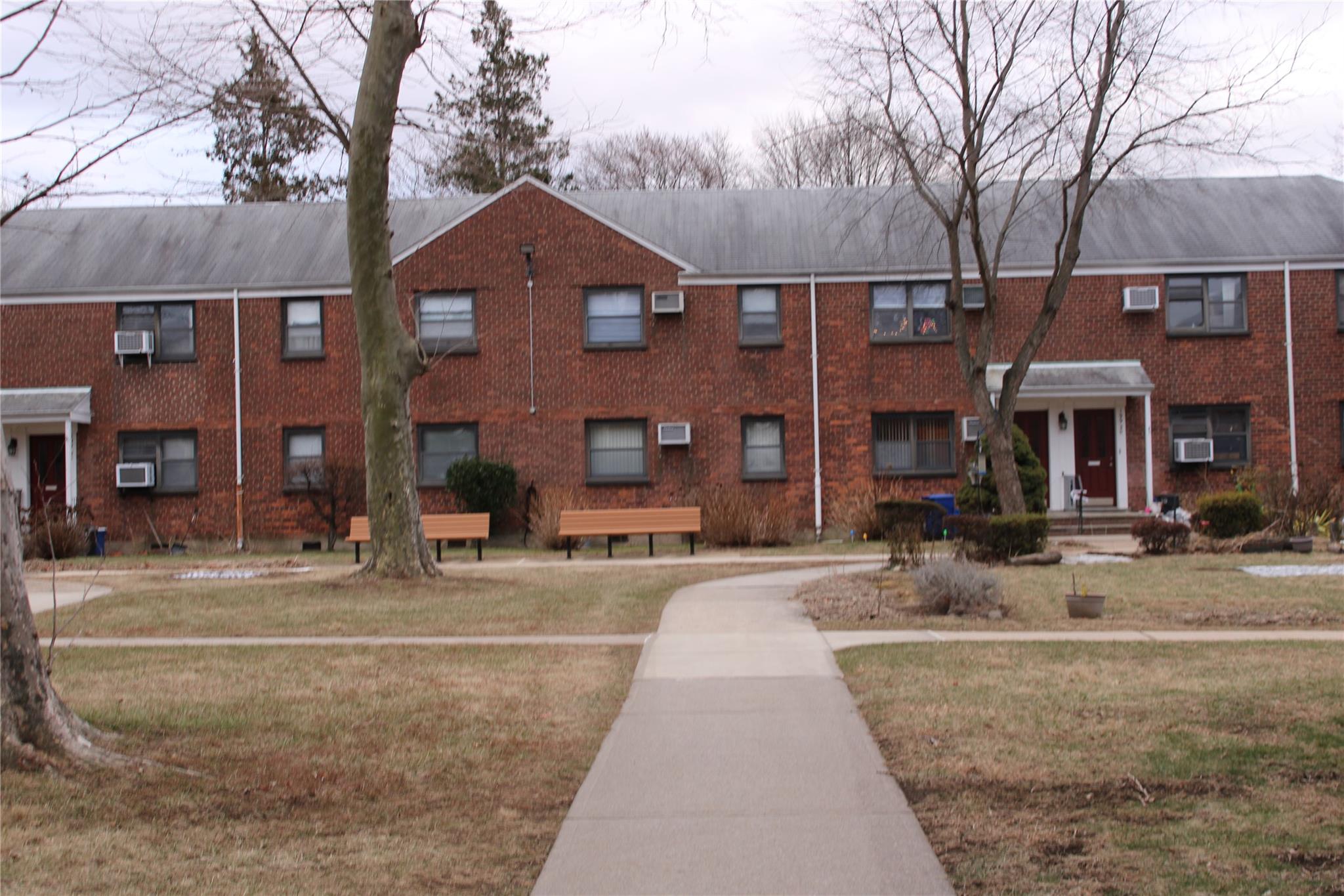 View of property with a wall mounted AC