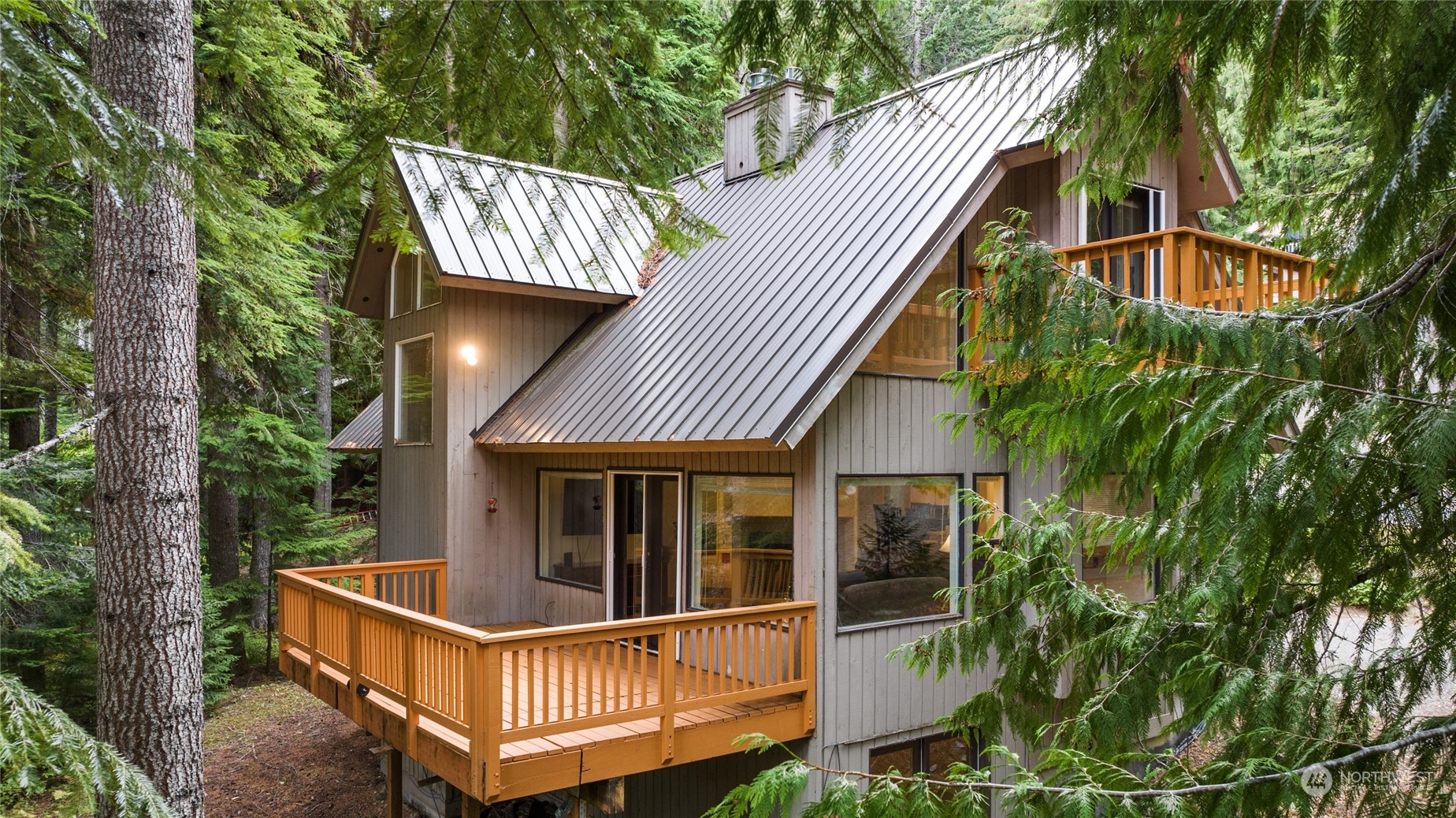 a view of a house with balcony and deck