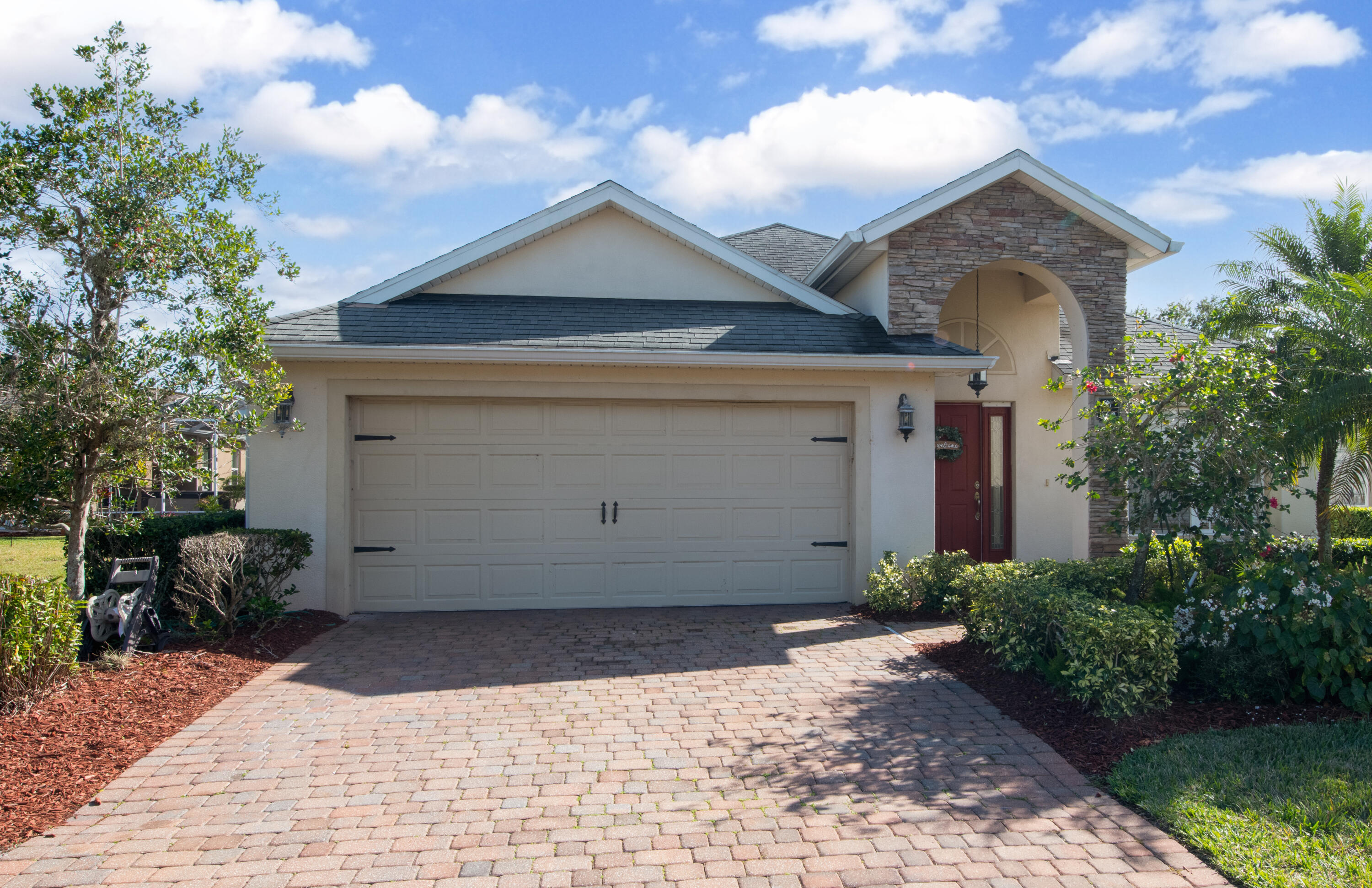 a front view of a house with a yard