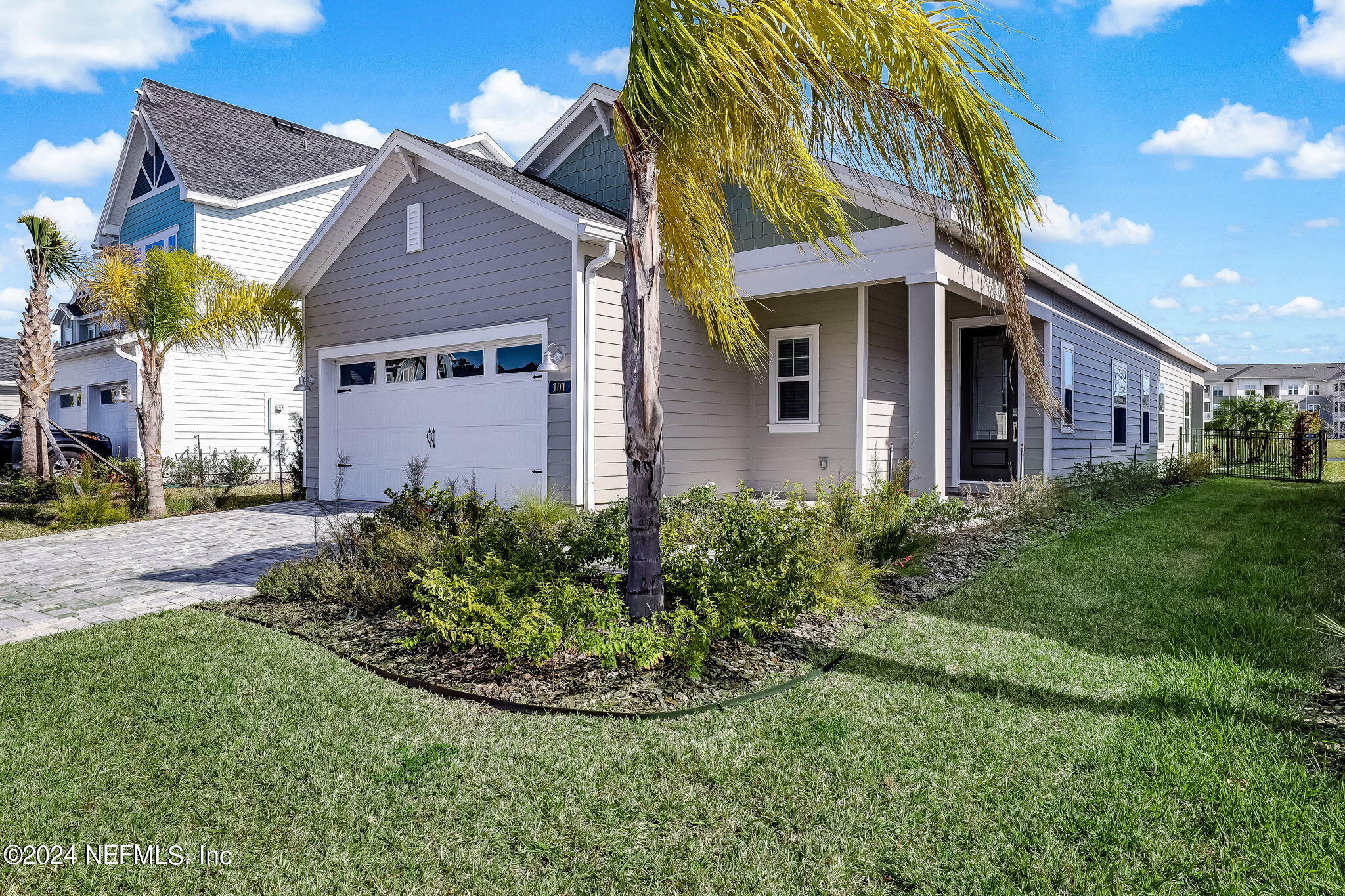 a view of a house with a yard and plants