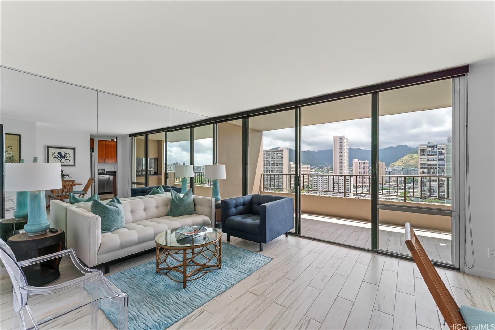 a living room with furniture and a large window