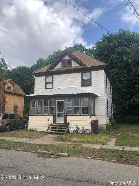 a front view of a house with a yard