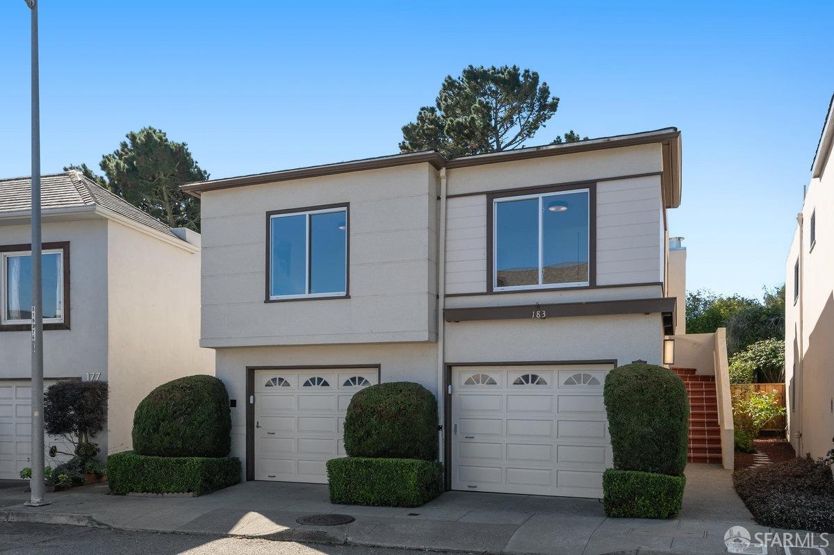 a front view of a house with a garage