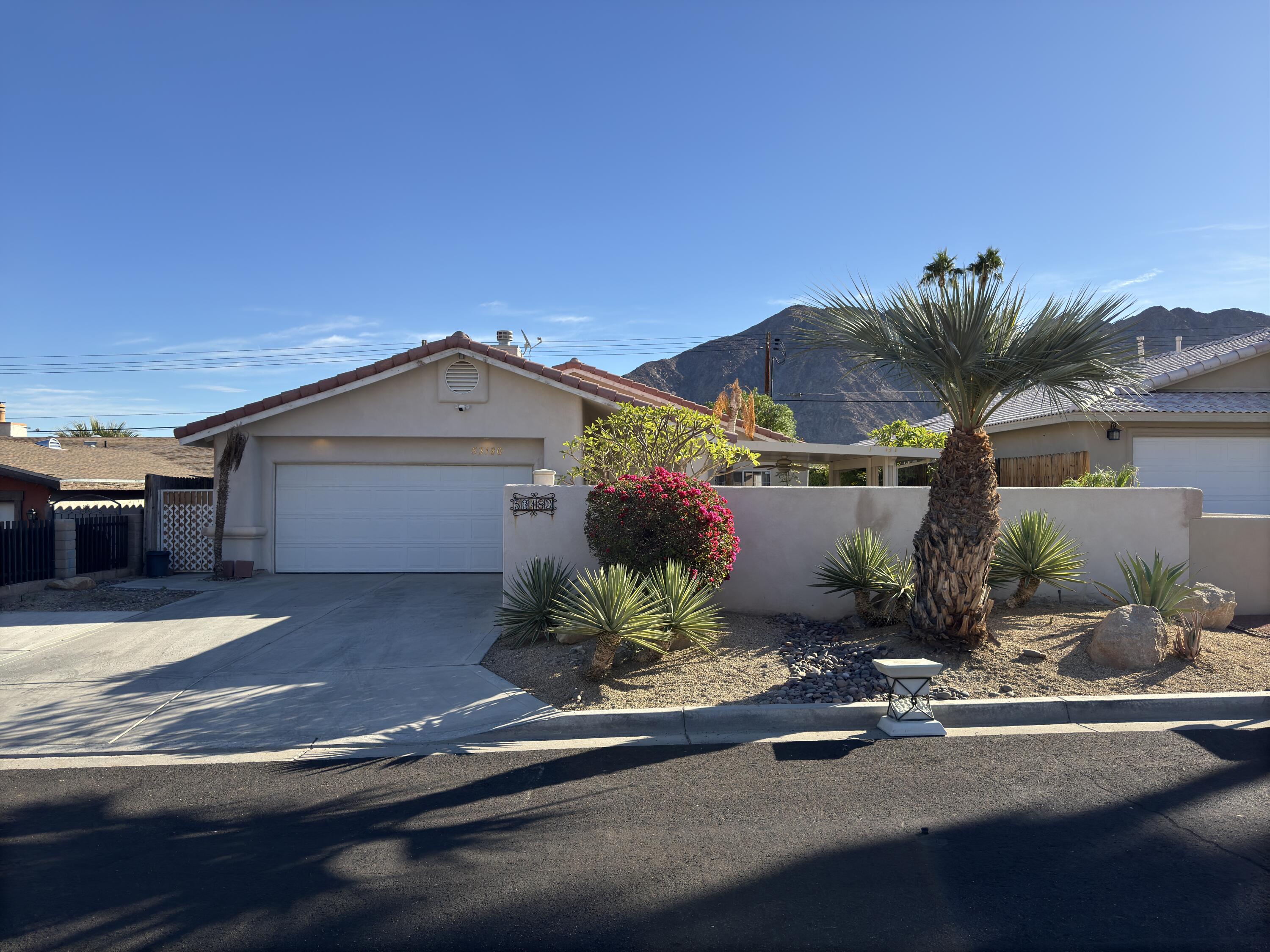 a view of a house with a street