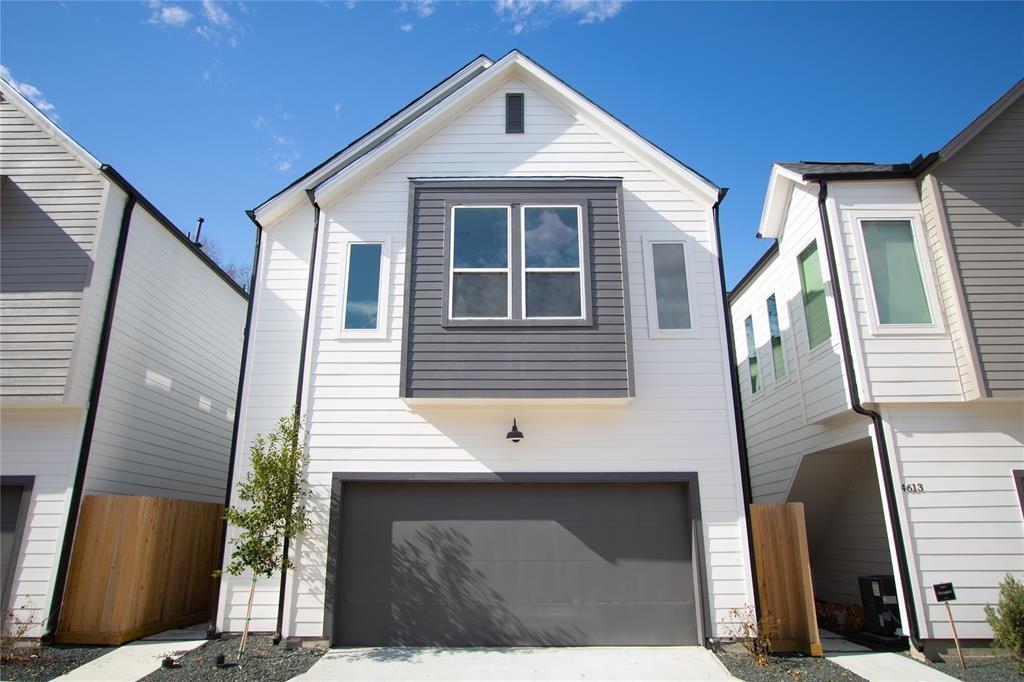 a front view of a house with garage