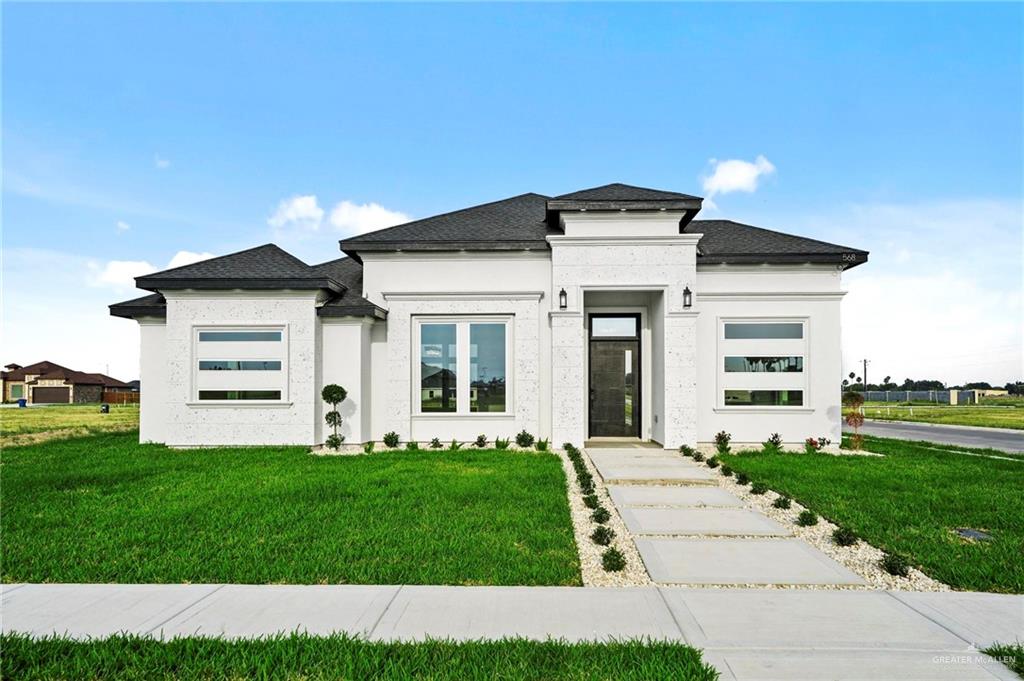 Prairie-style home featuring a front yard