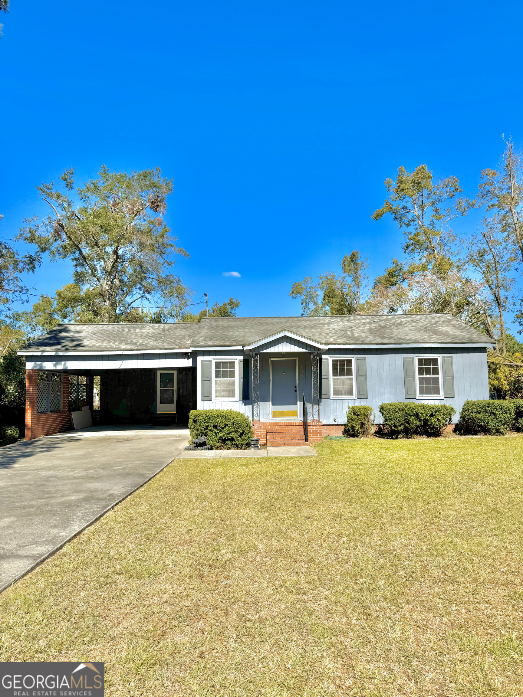 a front view of a house with a yard