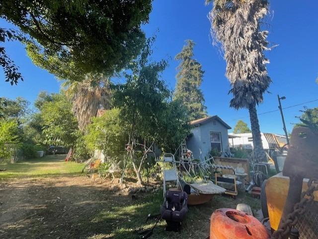 a view of backyard of house with outdoor seating