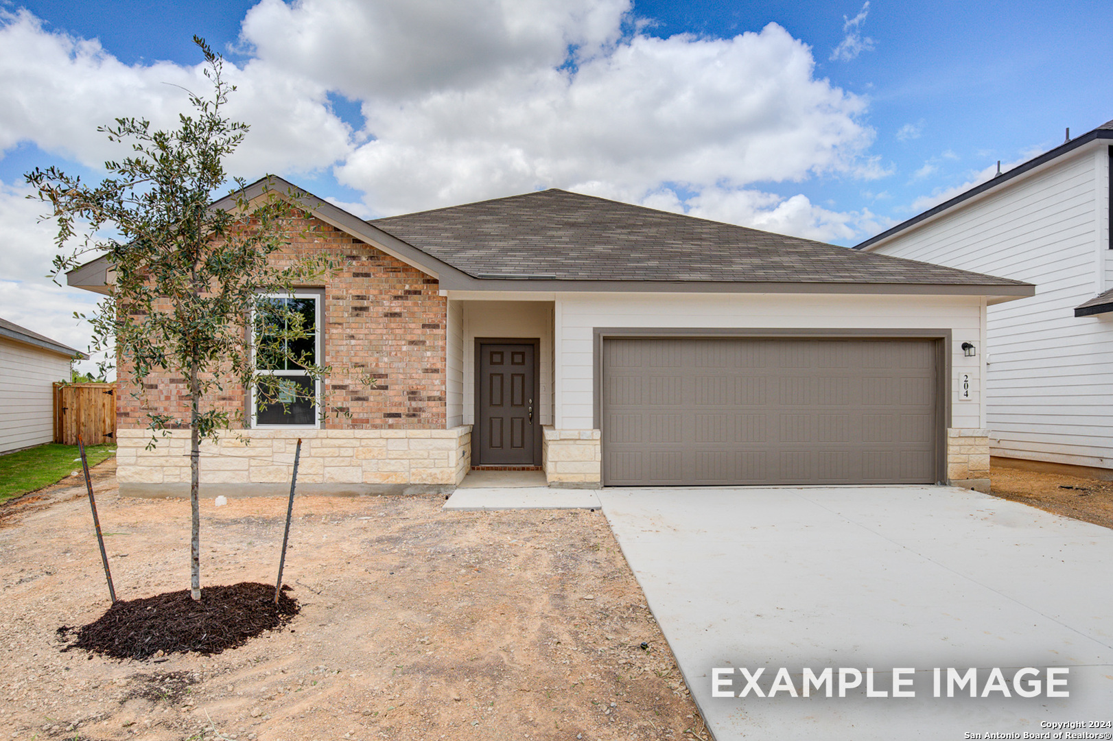 a front view of a house with a garage