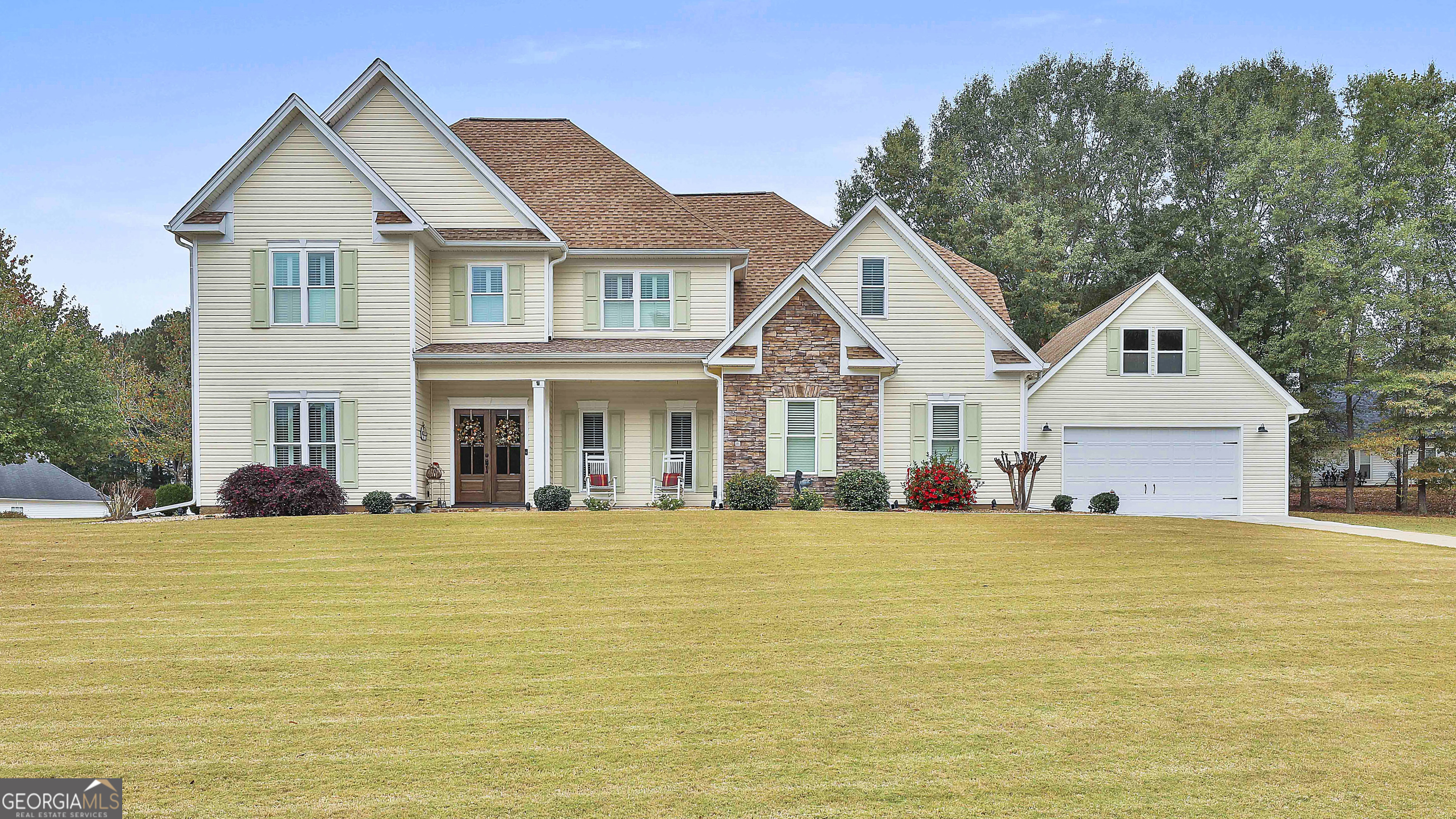 a front view of a house with a yard