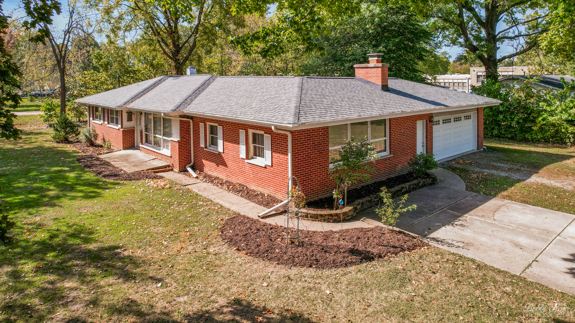 front view of a house with a yard