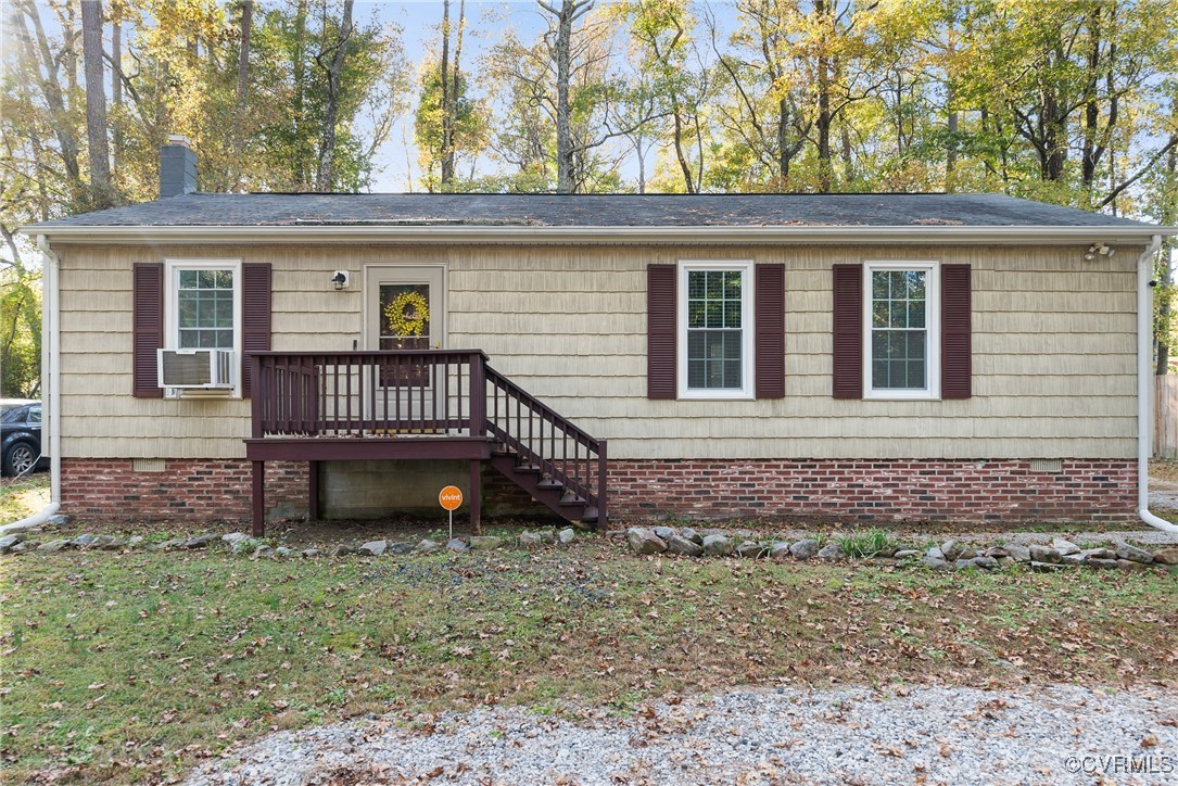 View of front of home with cooling unit