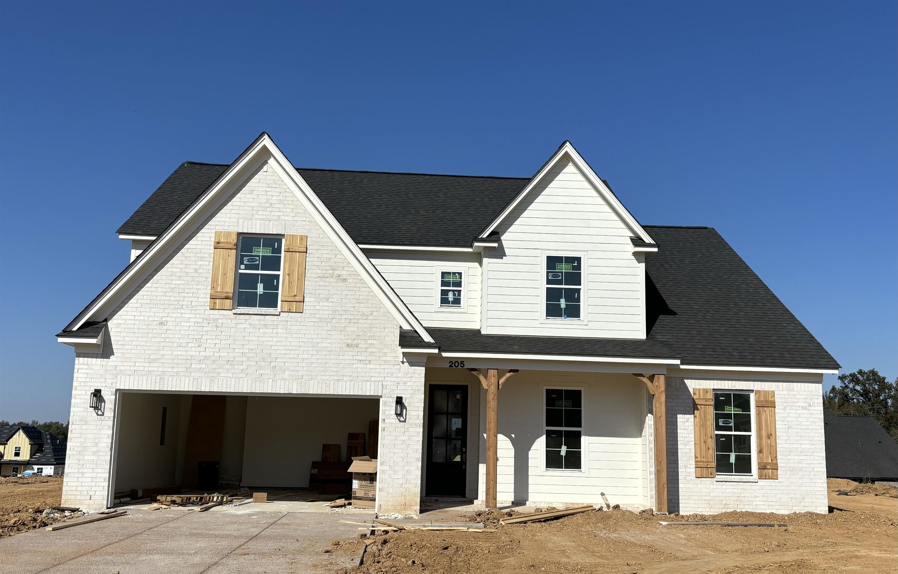 a front view of a house with garage