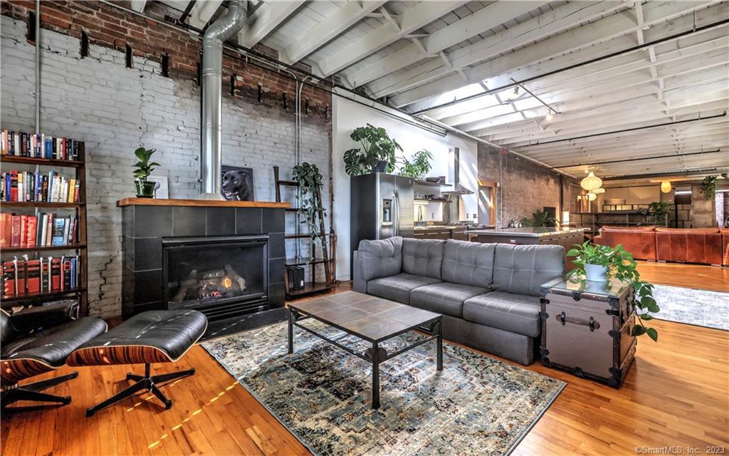 a living room with furniture and a fireplace