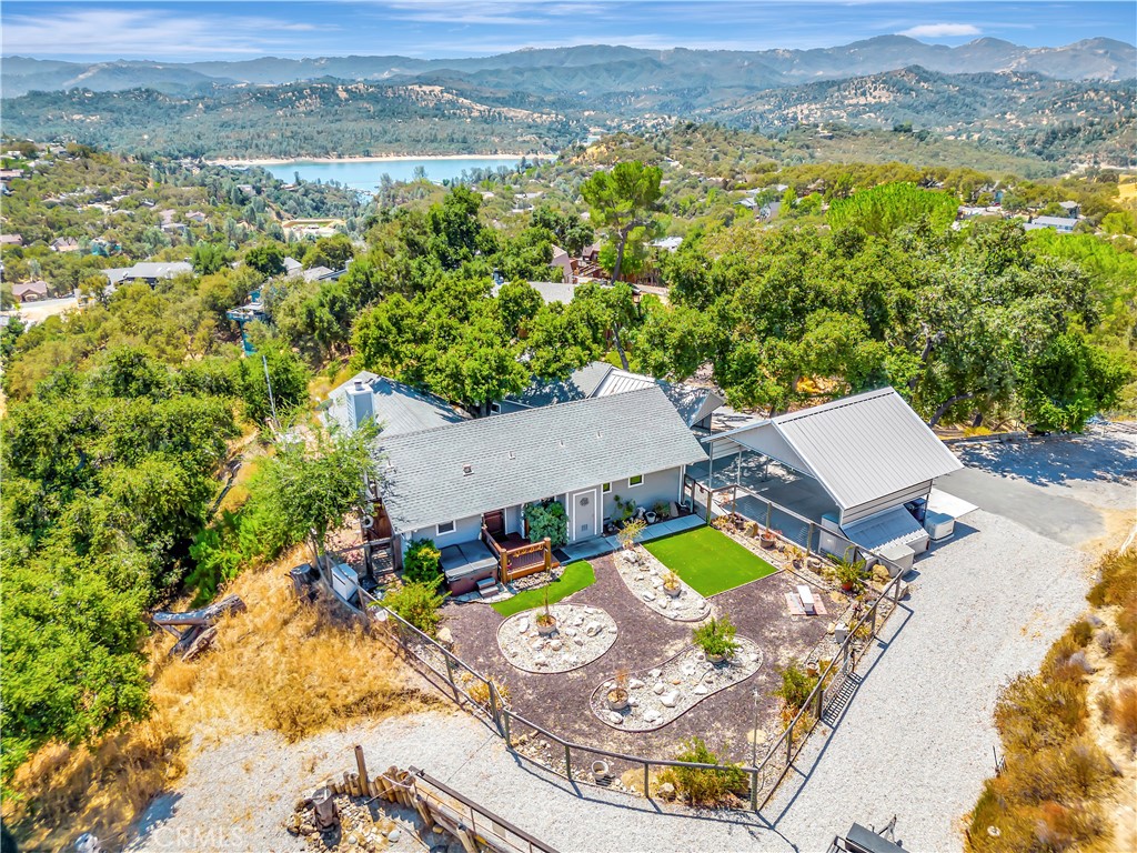 an aerial view of a house with a swimming pool