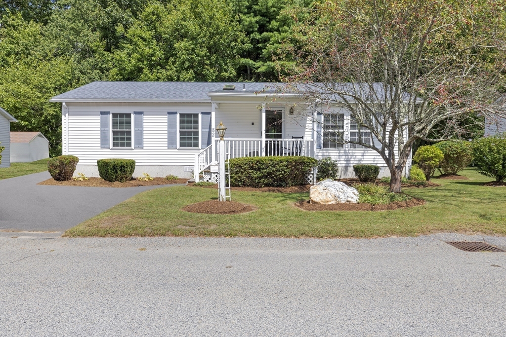 front view of a house with a yard