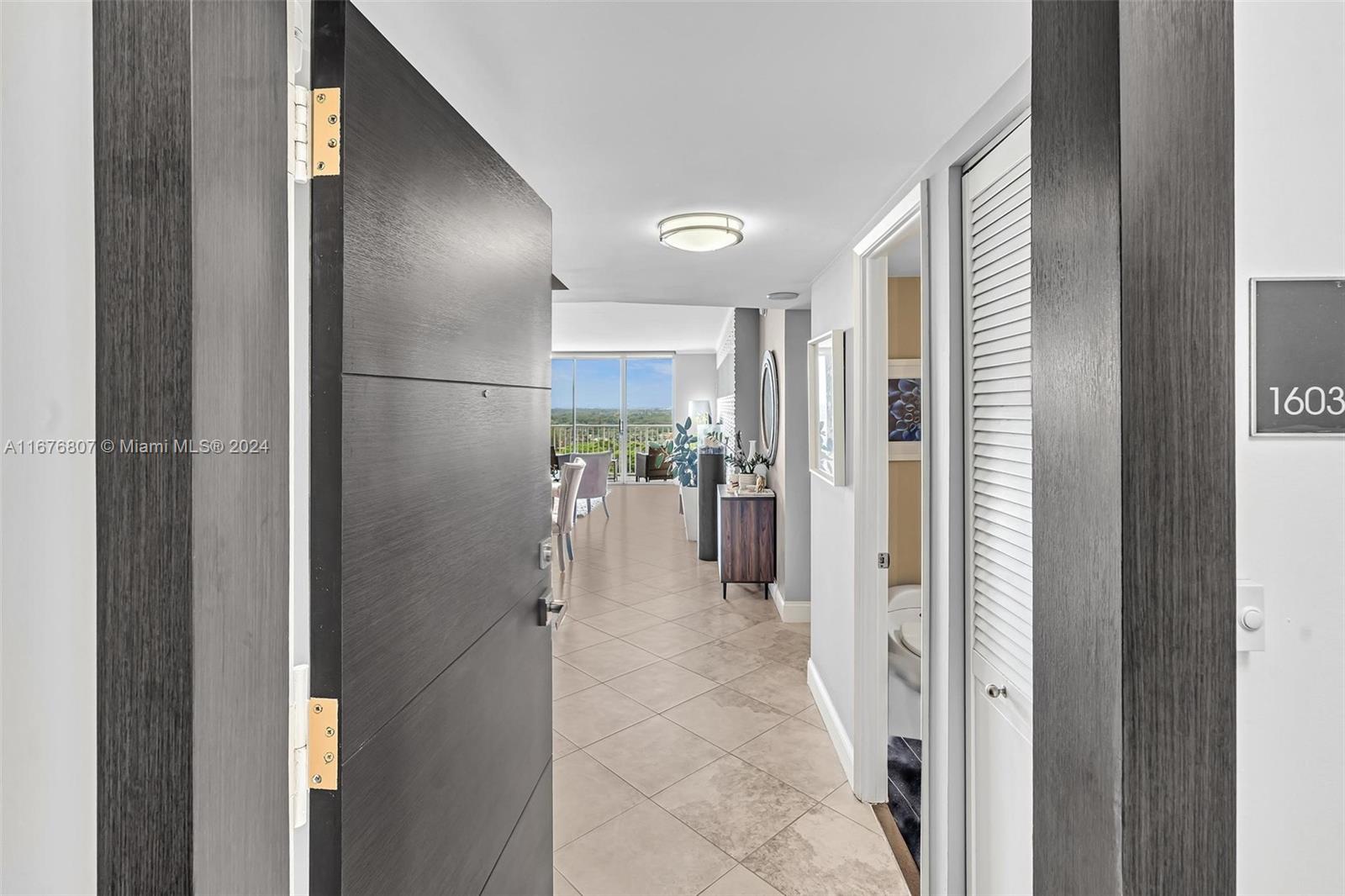 a view of a hallway with wooden shelves