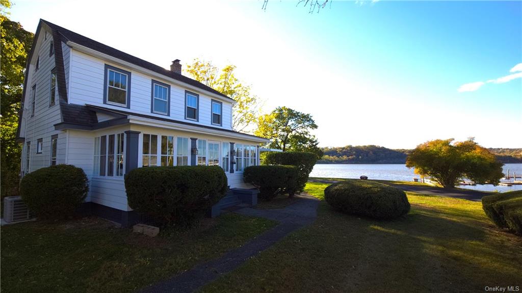 View of home's exterior set on the Hudson River.