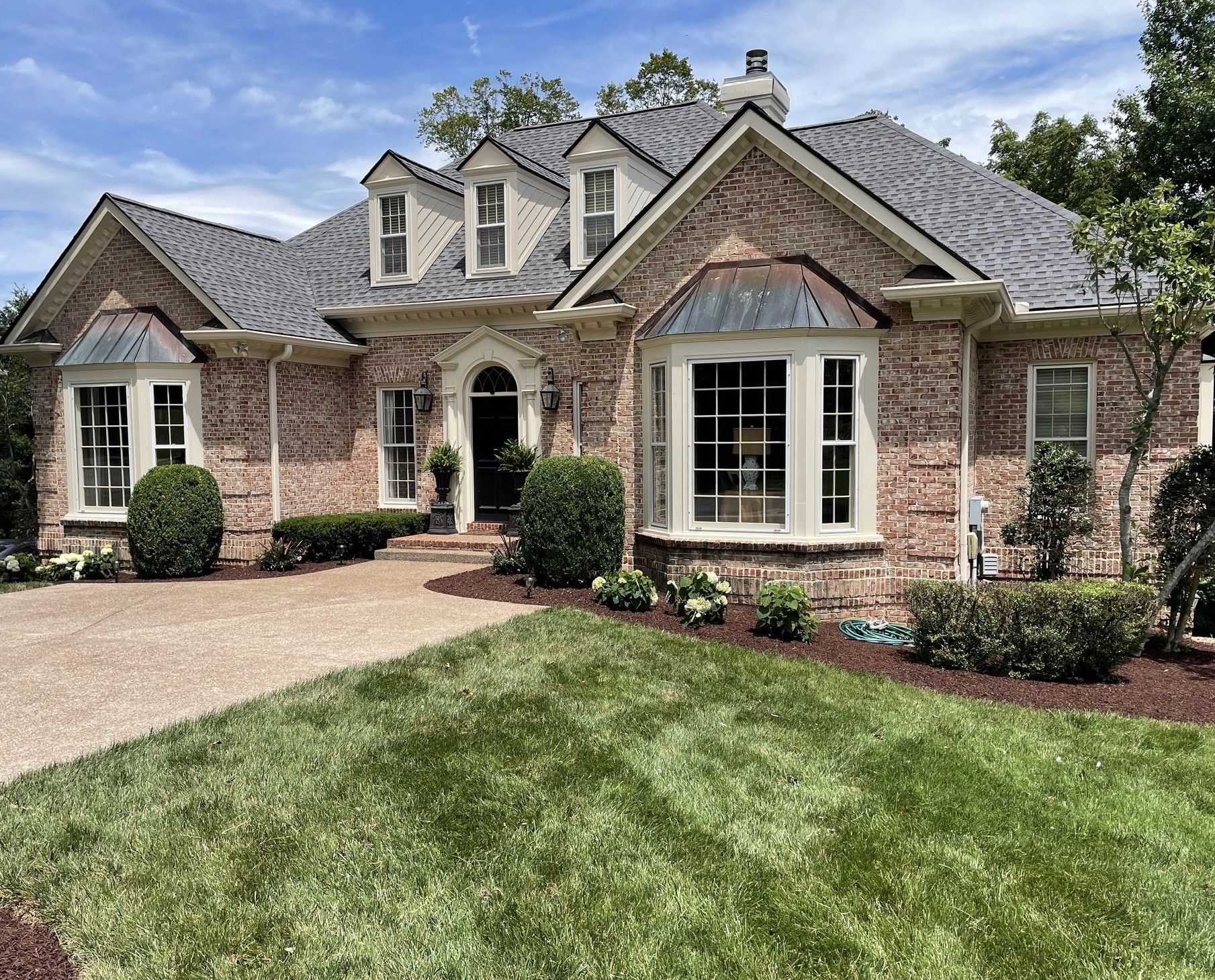 front view of a house with a yard