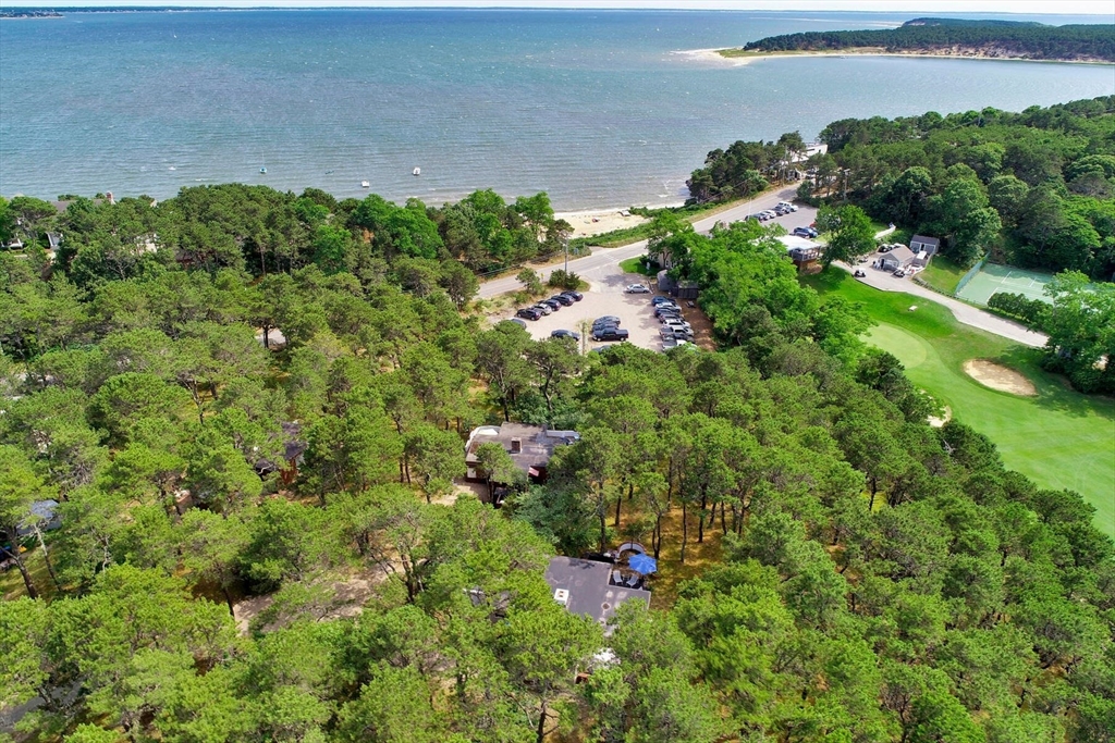 an aerial view of a house with a yard