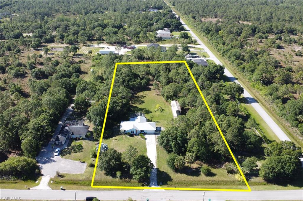 an aerial view of houses with yard