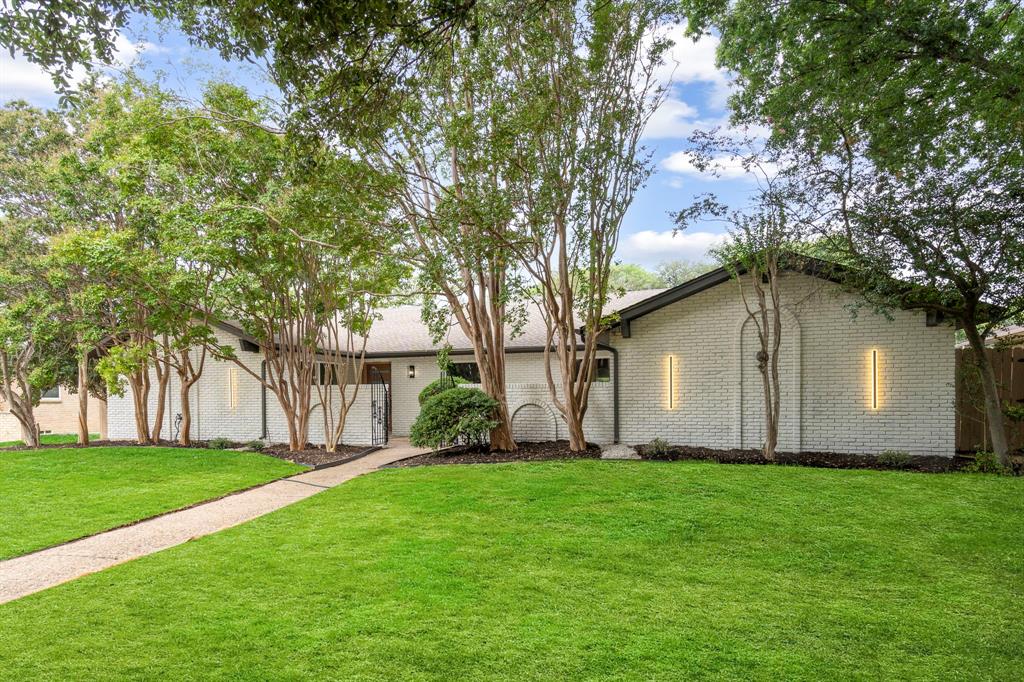 a backyard of a house with lots of green space