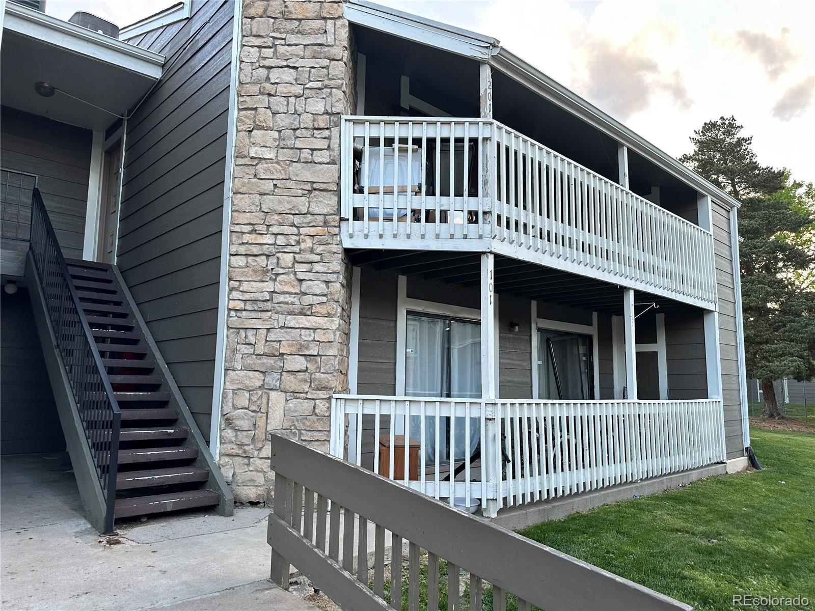 a view of a house with wooden deck