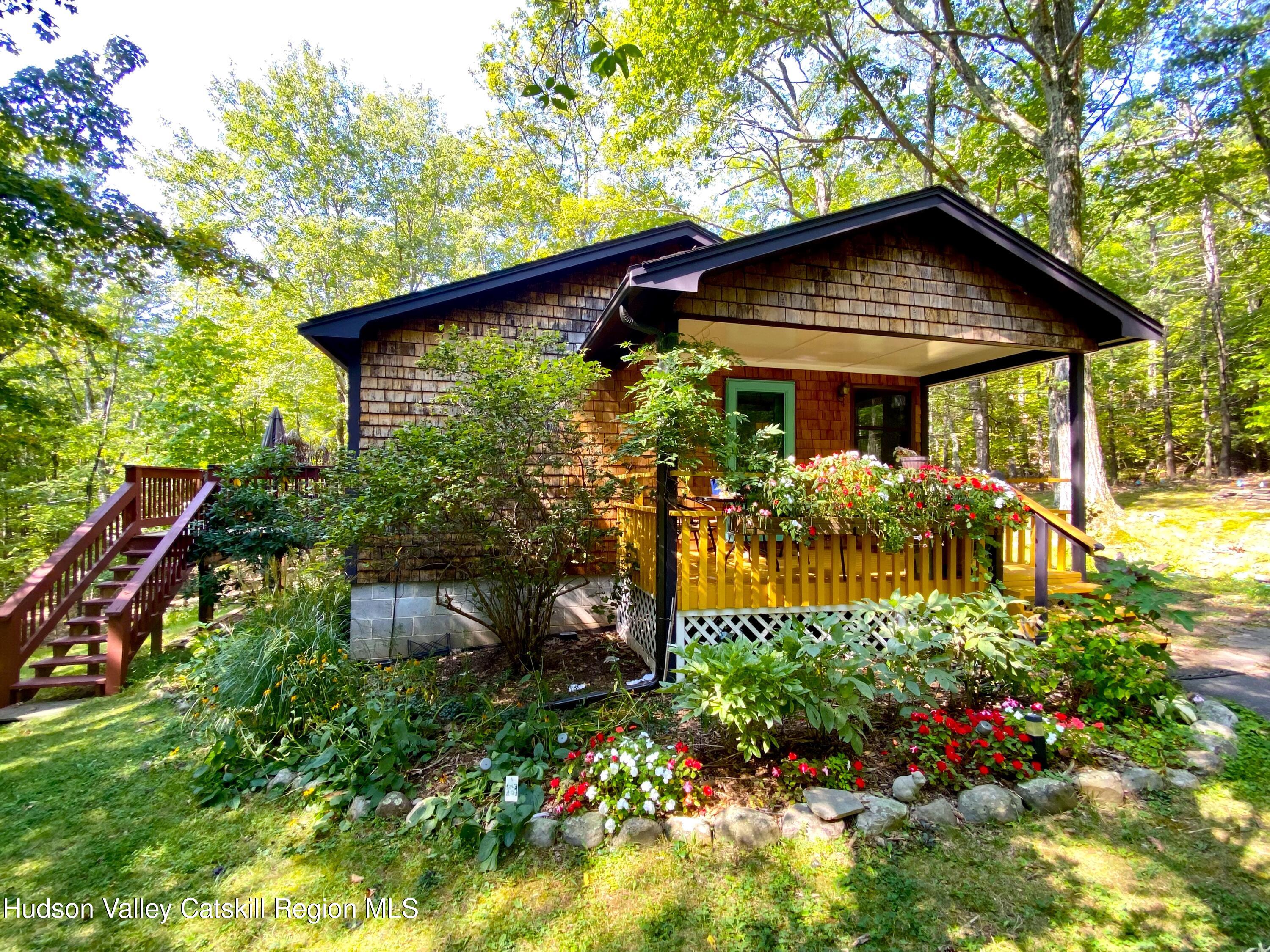 a backyard of a house with a garden and plants