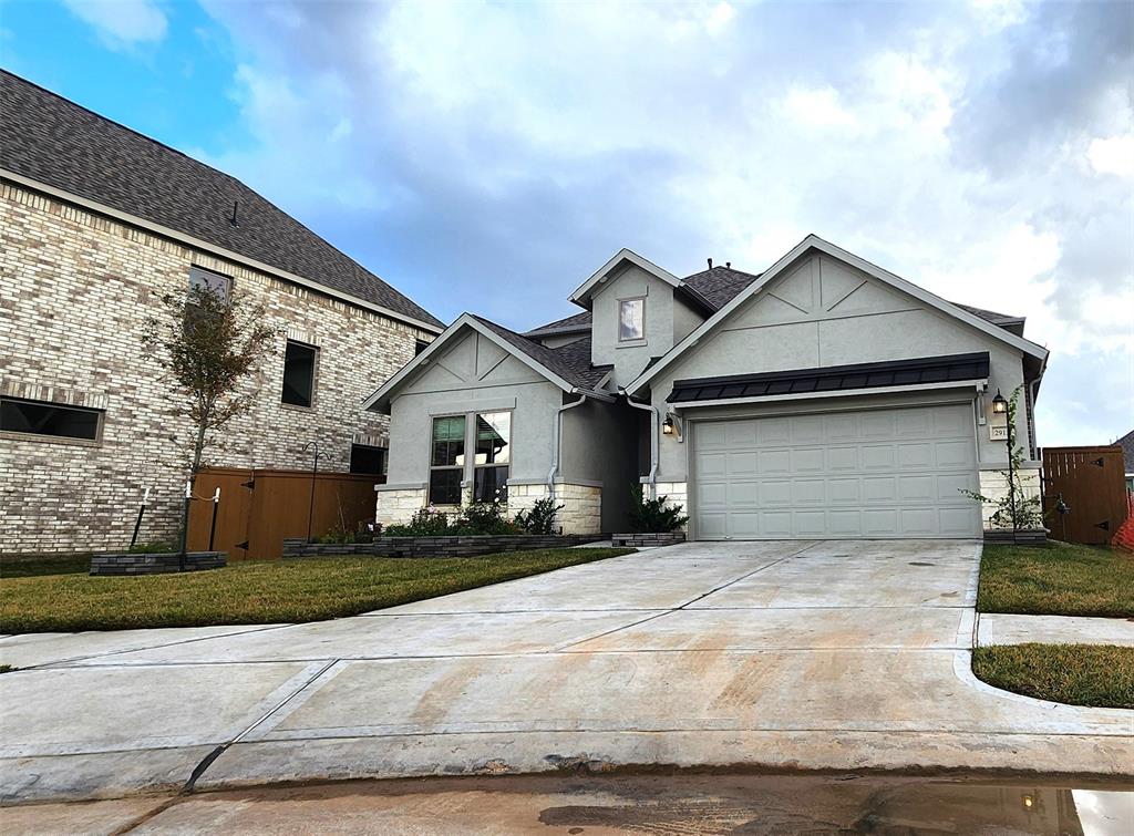 a front view of a house with garage