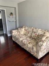 a bed sitting in a bedroom next to a cabinet