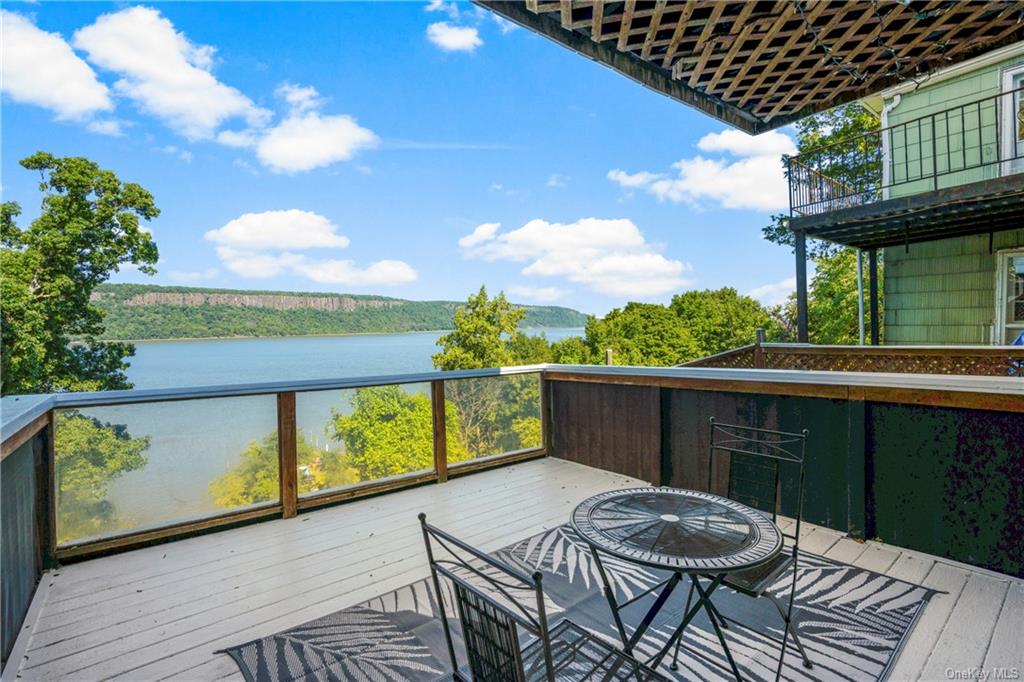 a view of balcony with furniture