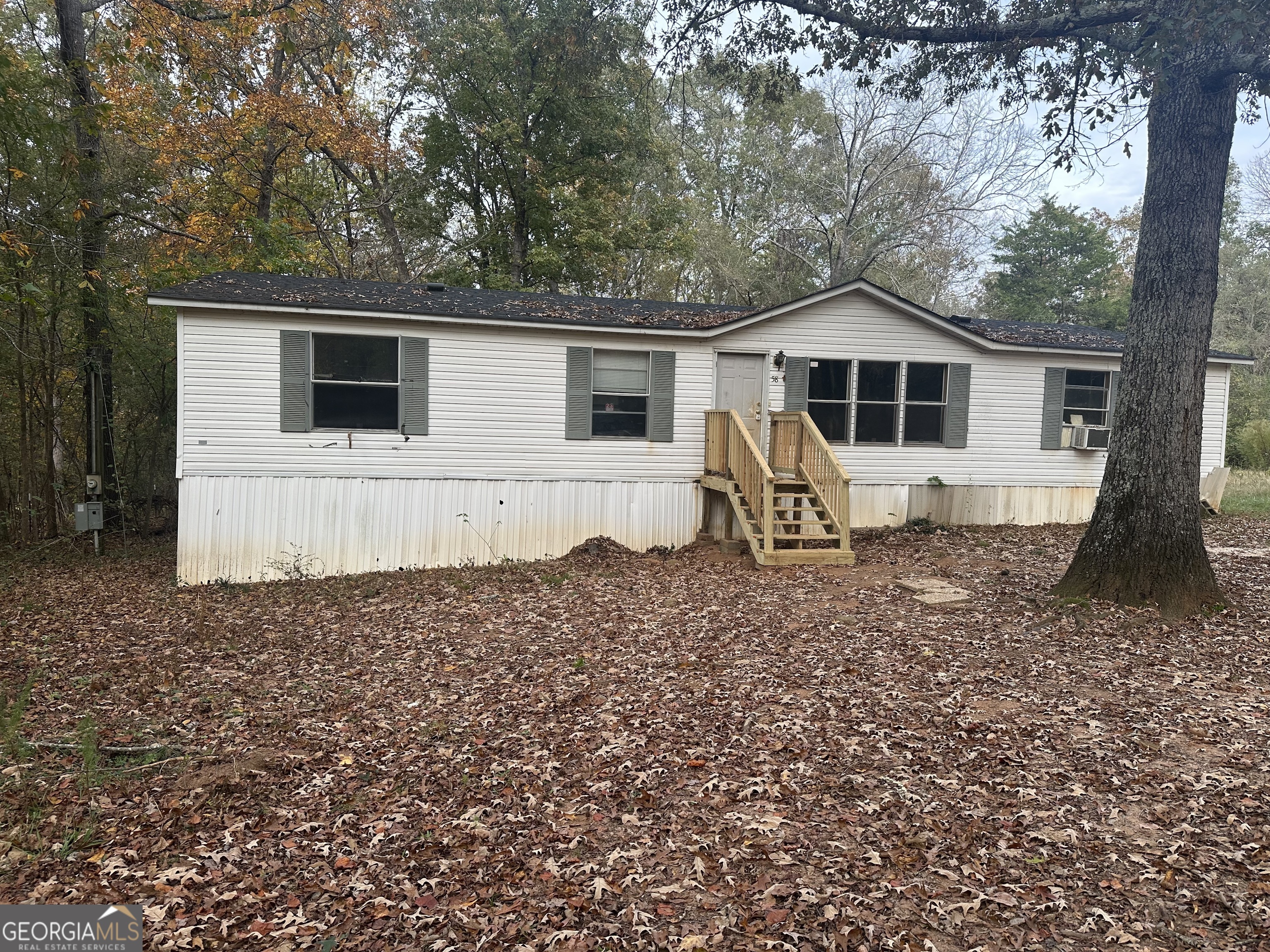 a house with trees in the background