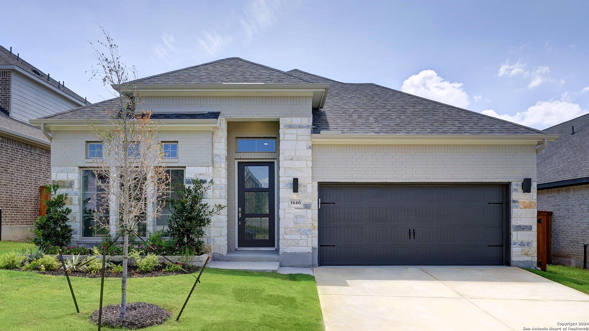 a front view of a house with a yard