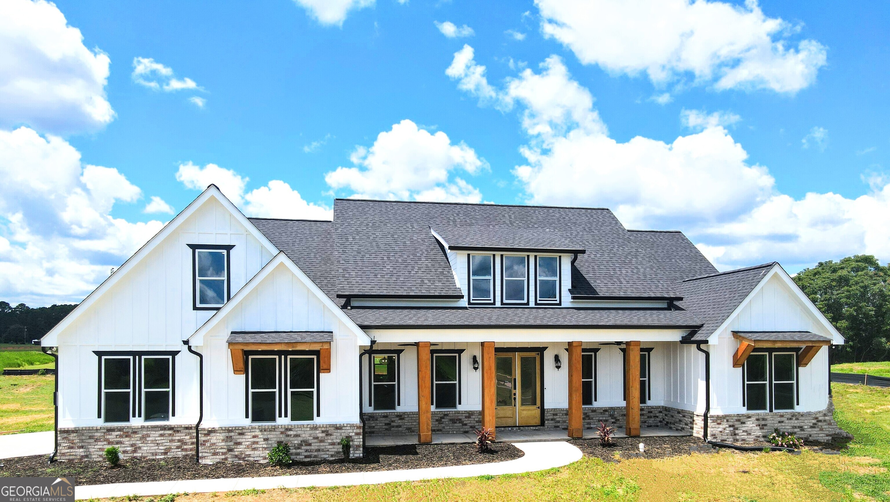 a front view of a house with a yard