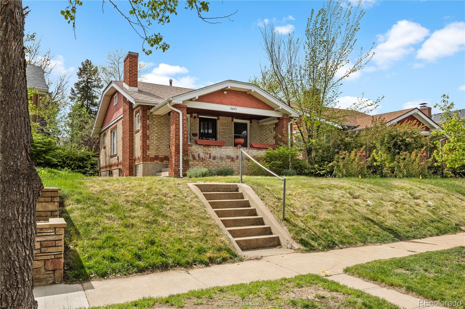 a front view of a house with yard