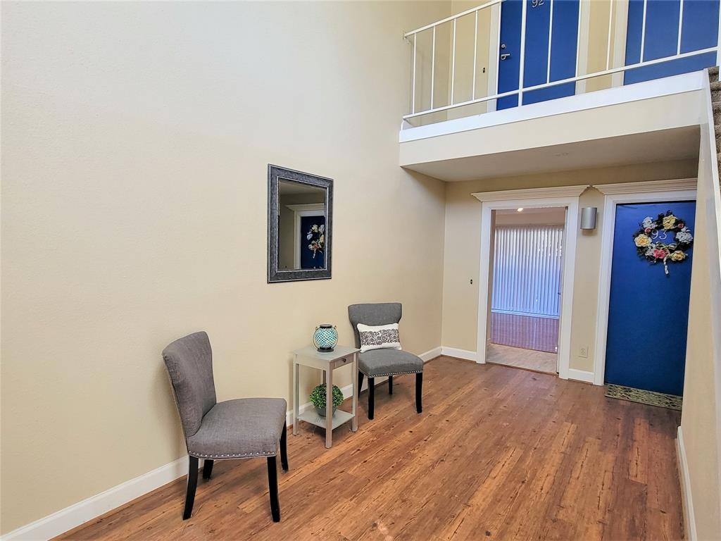 a workspace room with furniture and wooden floor