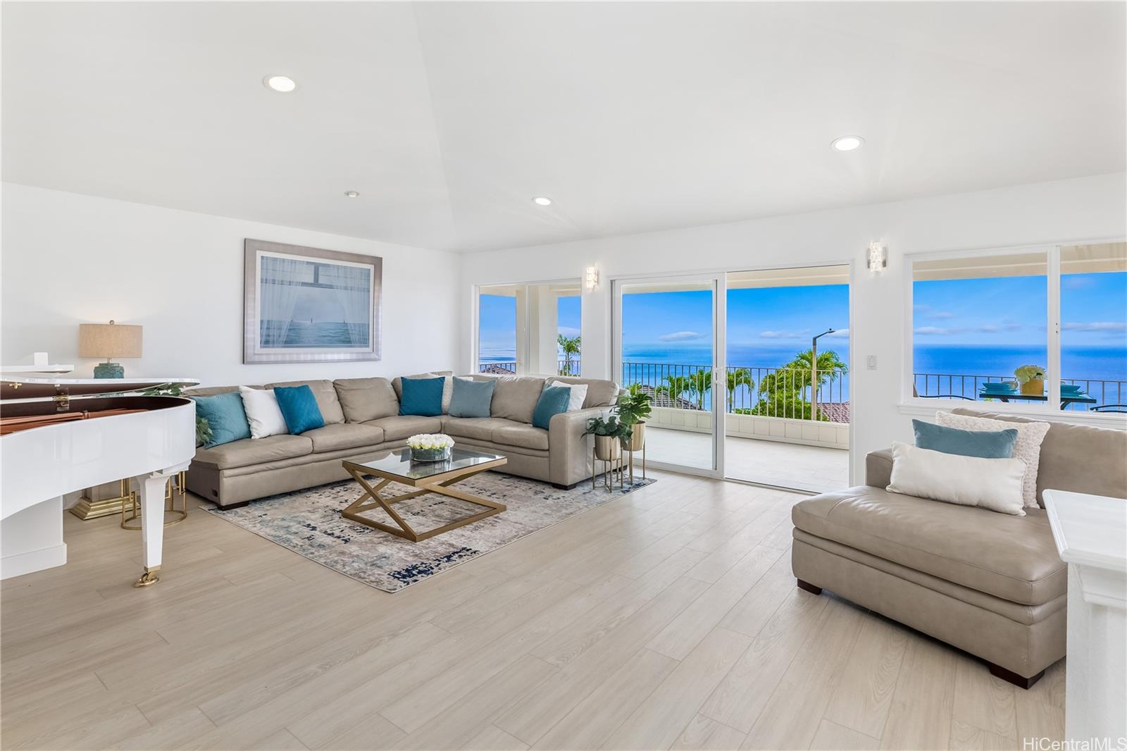 Sleek lines, a high peaked ceiling, and a wall of windows, captures the natural light and the magnificent ocean views. There is also contemporary new flooring throughout.