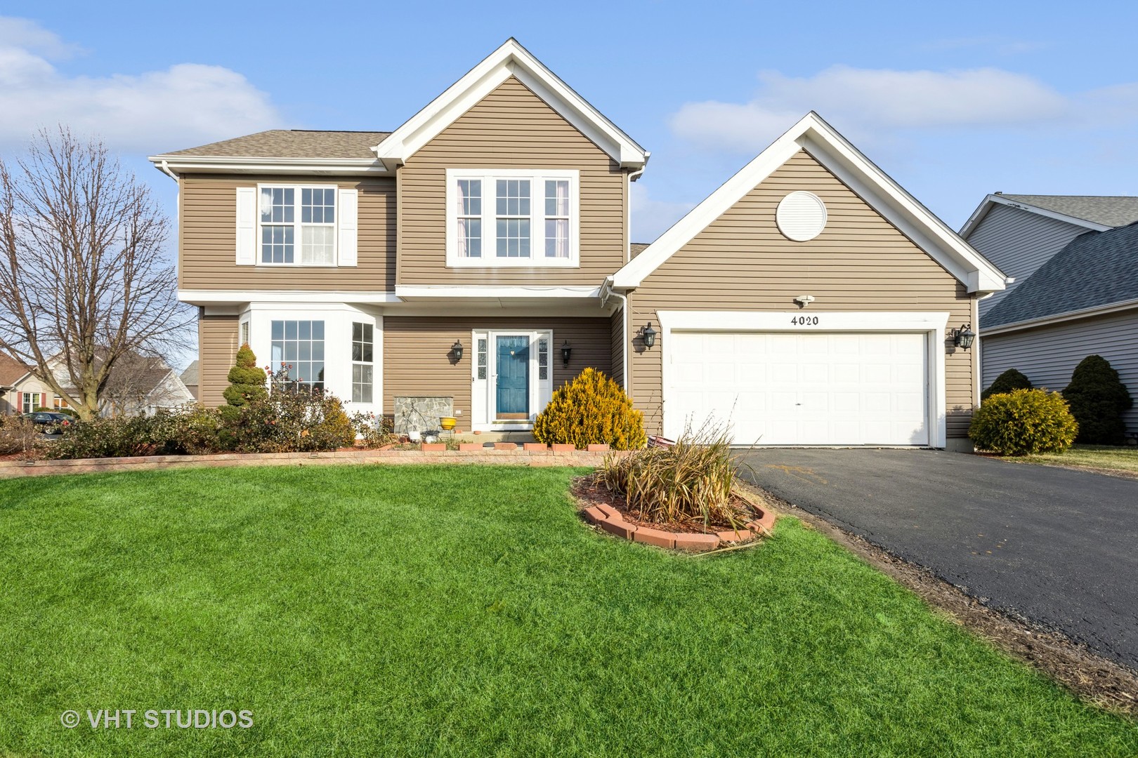 a front view of a house with a yard