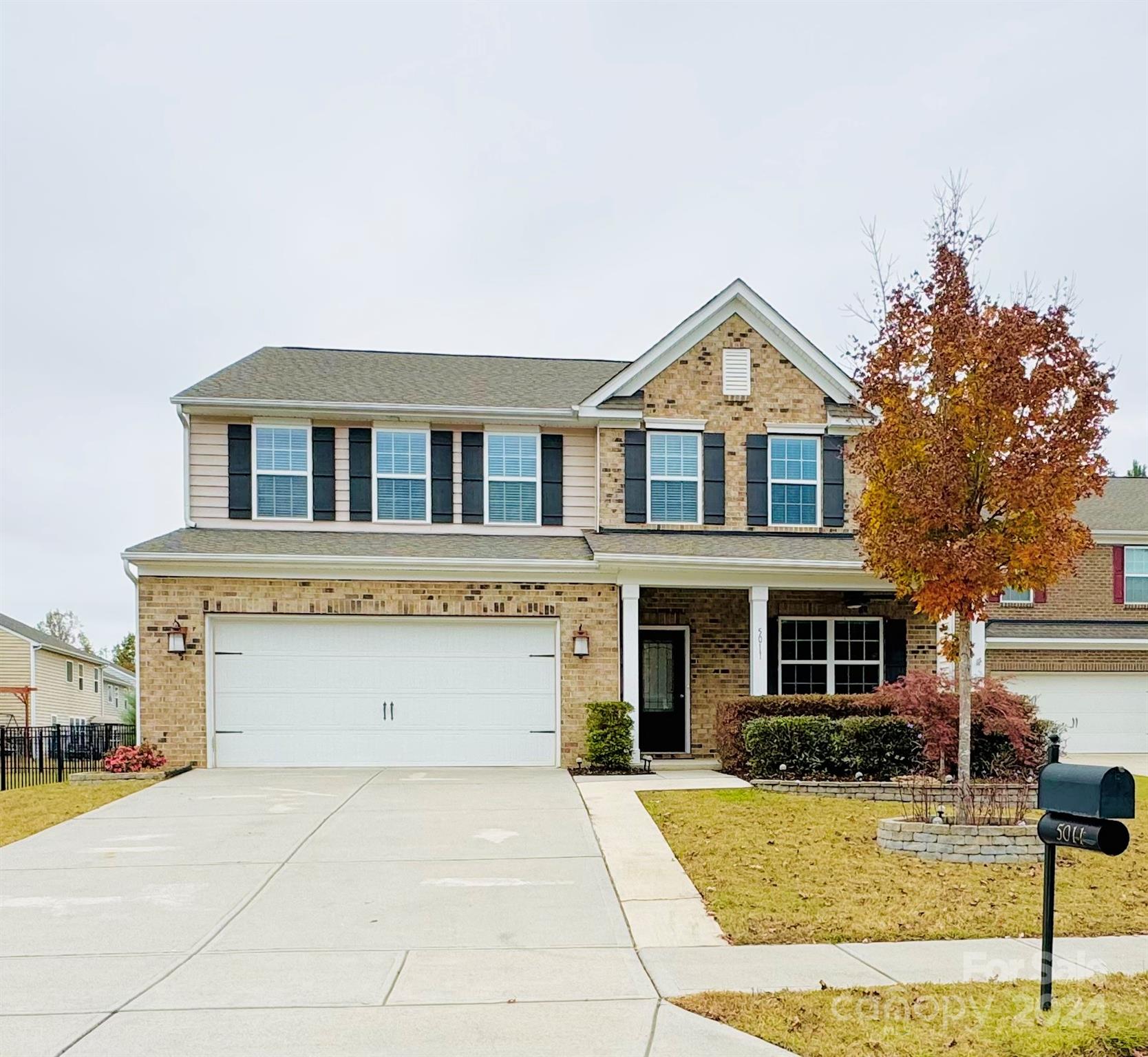 a front view of a house with yard