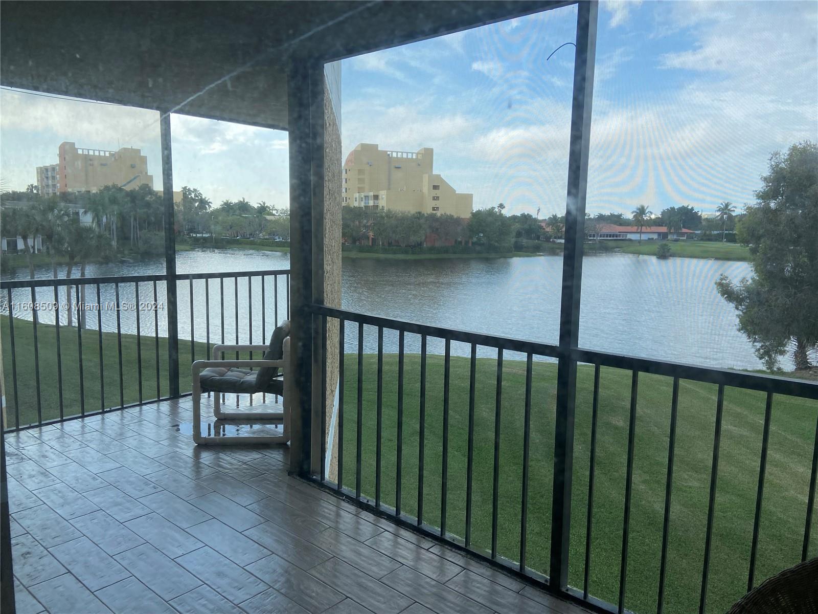 a view of a balcony with wooden floor