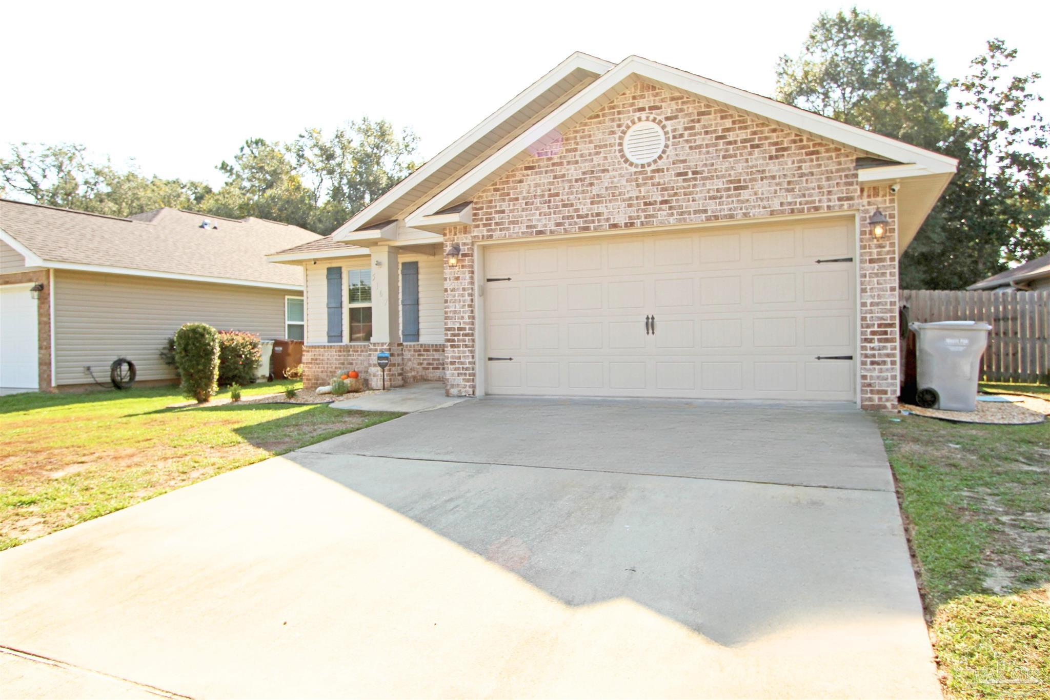 a view of a house with backyard