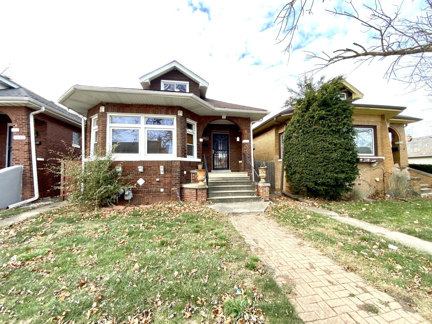 front view of a house with a yard