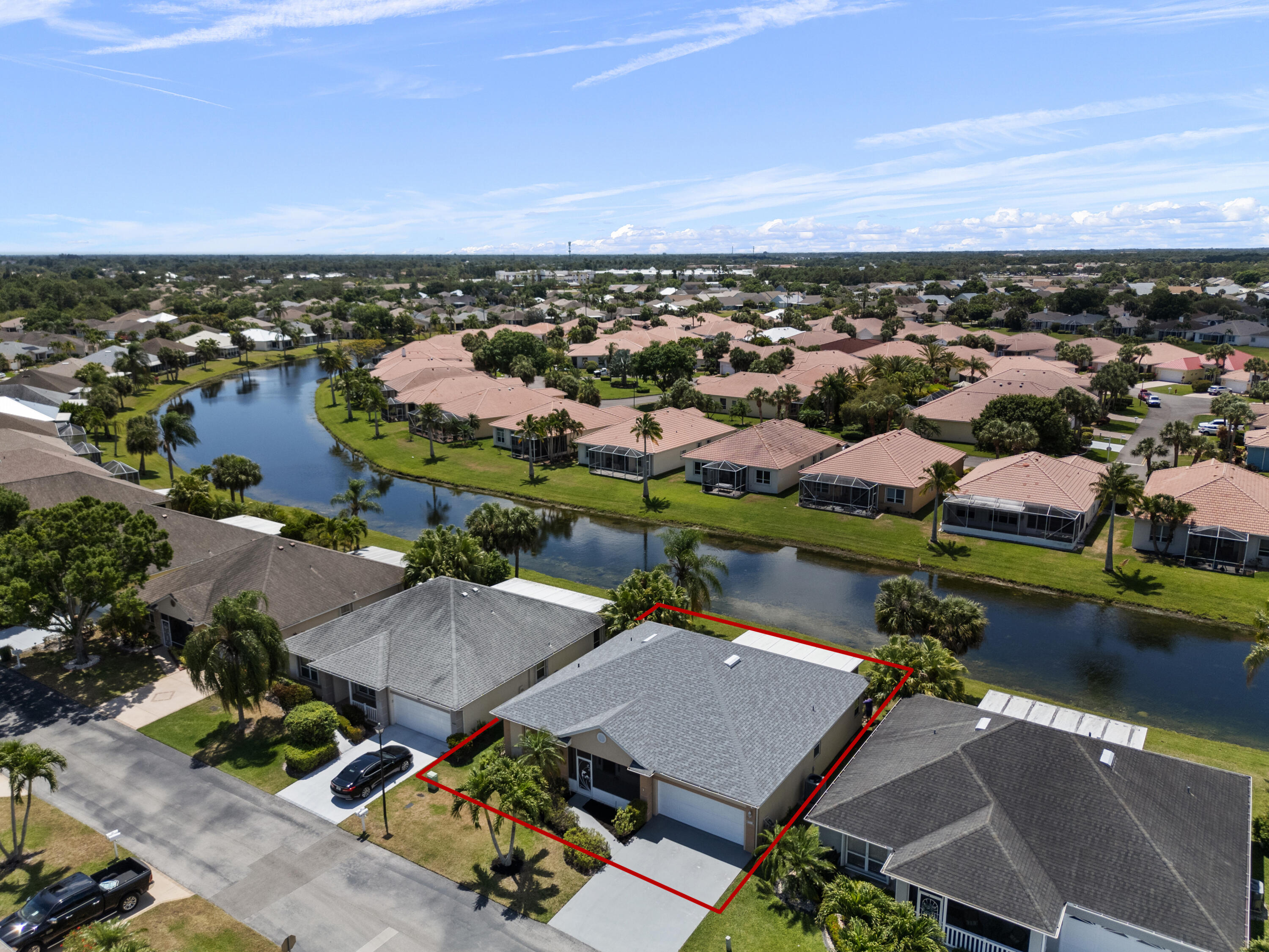 an aerial view of a houses with a city view