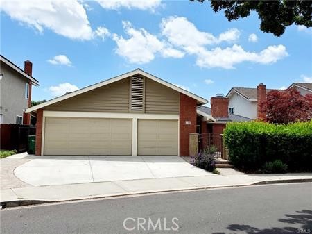 a front view of a house with a garage