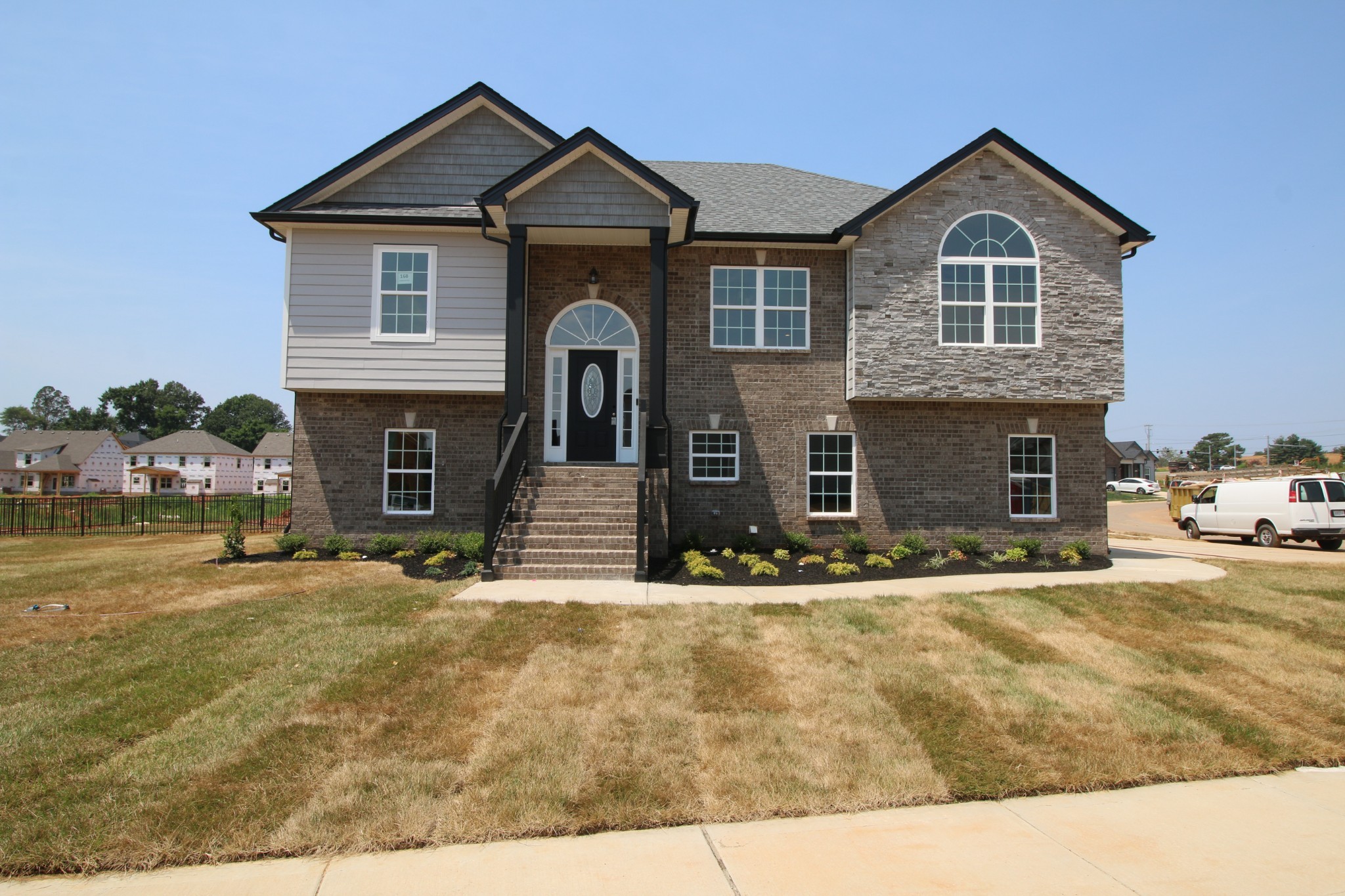 a front view of a house with a yard